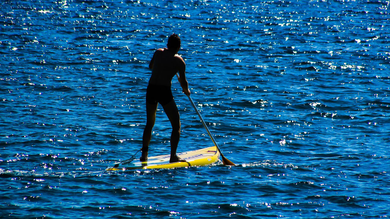 man paddleboarding